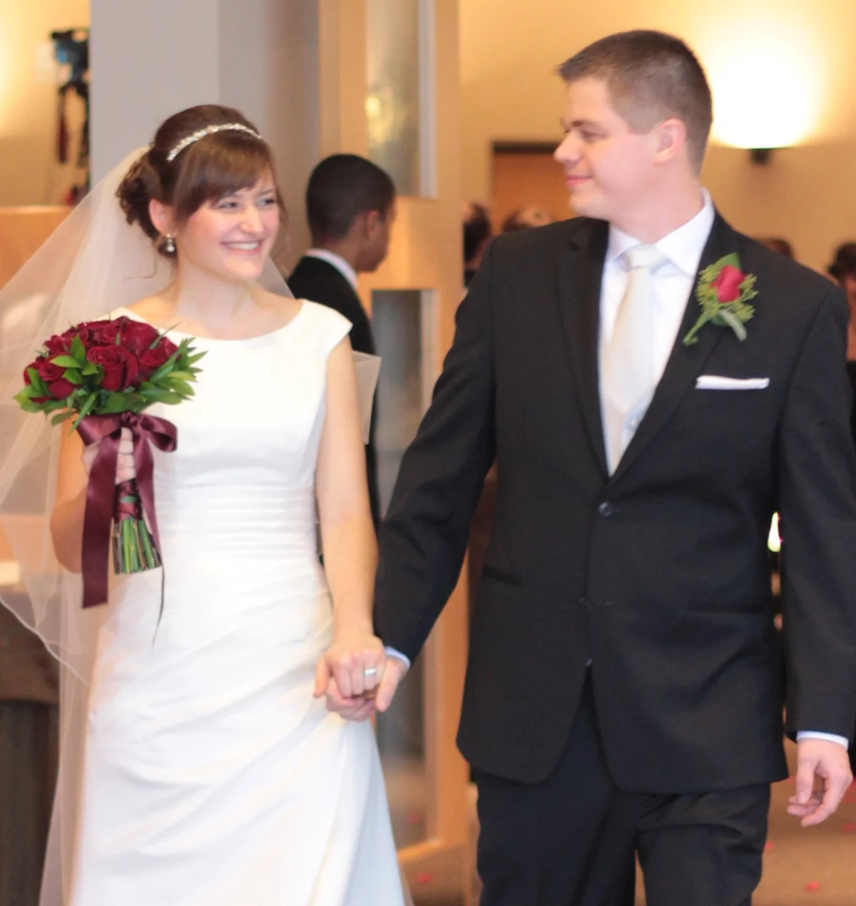 A newly married couple leaving the sanctuary